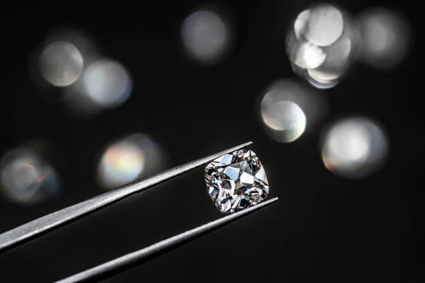 istock Diamond in Tweezers 1205118647
