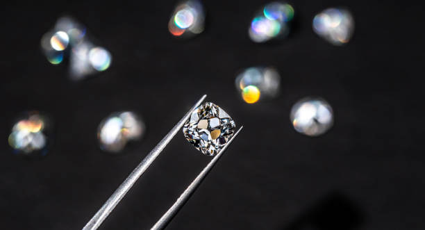 istock Diamond in Tweezers 1205118715