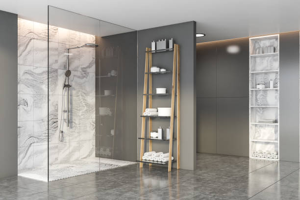 istock Grey and marble bathroom with shower stall 1205119802