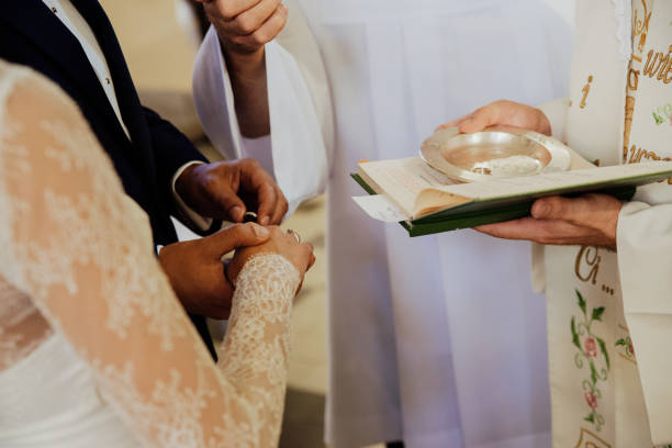 istock the young couple puts on rings during the wedding 1205120128