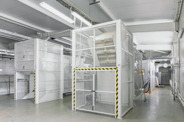 istock Industrial interior workshop with automated machine line for blowing plastic bottles from PET preforms 1205124058