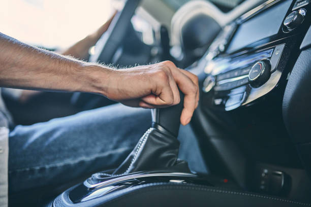 istock Close-up male hand switching a gearbox 1205128153
