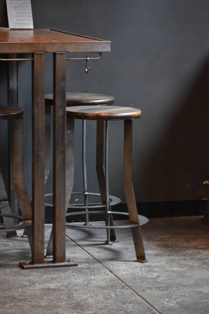 istock Empty wooden and metal barstools 1205132999