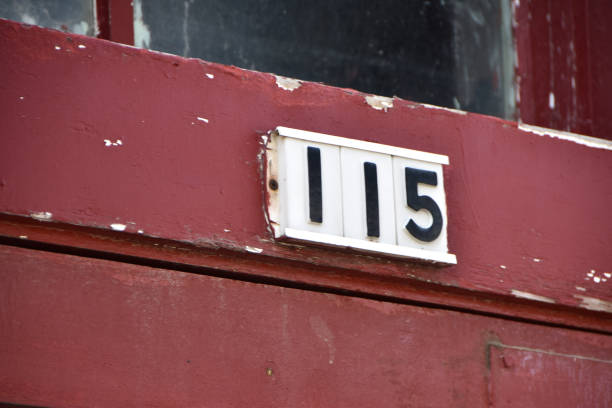 istock Posted address numbers 115 in black on a white back 1205134073