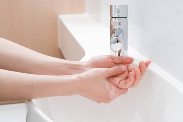 istock Asian woman washing hands 1205137917