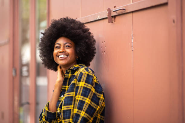 istock happy beautiful young black woman with afro 1205138510