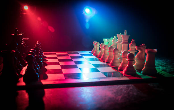 istock Chess figures on a dark background with smoke and fog. Selective focus 1205138982