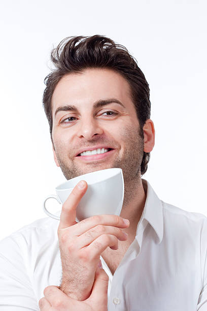 istock man holding cup of coffee 120514024