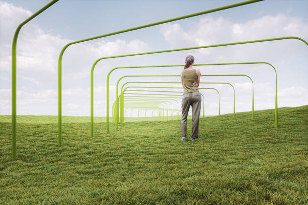 istock Young woman standing in fantasy meadow 1205143427