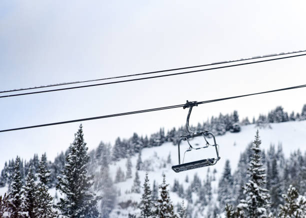 istock Chair lift above snowy trees 1205143460