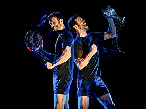 istock Tennis player man light painting isolated black background 1205143522