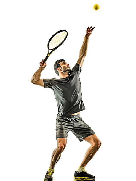 istock mature tennis player man serving service isolated white background 1205143612