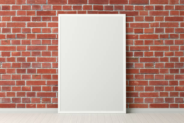 istock Blank poster frame mock up standing on the floor next to wall 1205144599