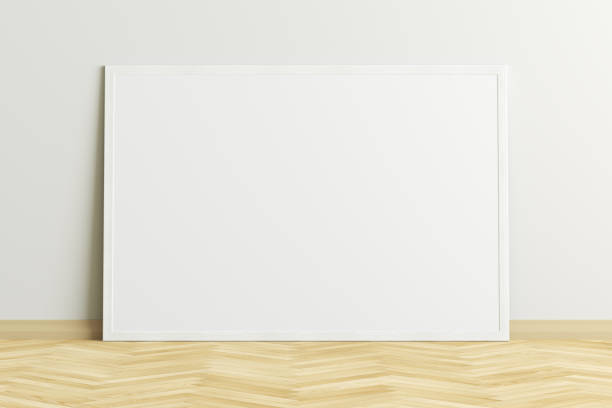 istock Blank poster frame mock up standing on the floor next to wall 1205144609