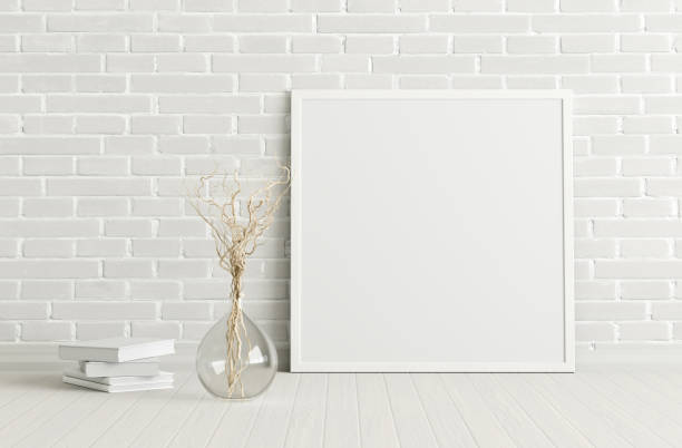 istock Blank poster frame mock up standing on the floor next to wall 1205144662