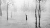 Young woman walking in fantasy winter landscape
