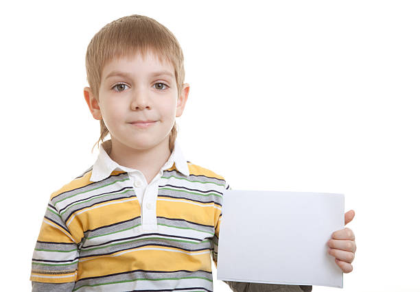 istock Boy holding blank sheet of paper 120515266