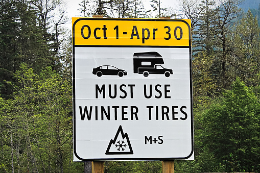 A must use winter tires with dates sign.