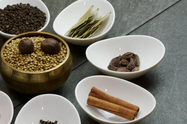 istock Bowls with whole Indian aromatic spices filling the frame. 1205156239