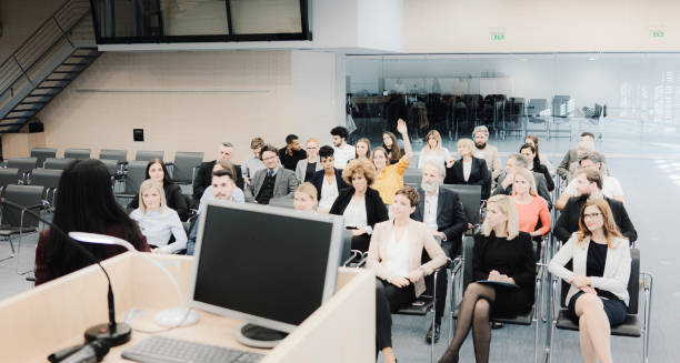 istock Business people sitting at seminar 1205156343