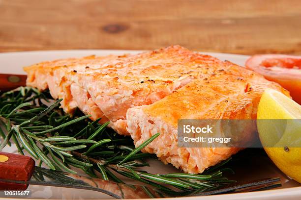 Roast Salmon On Plate Over Wood Stock Photo - Download Image Now - Backgrounds, Baked, Barbecue - Meal