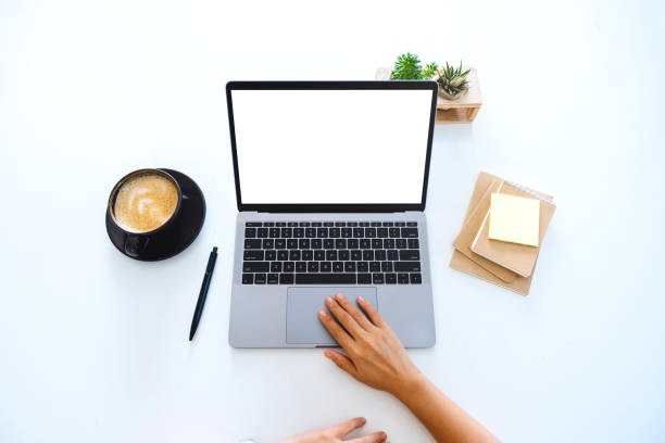 istock hands using and touching on laptop touchpad with blank white desktop screen on the table 1205165041