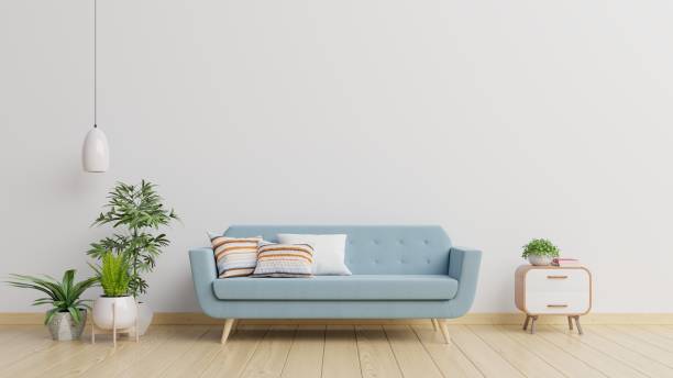 istock Modern living room interior with sofa and green plants,lamp,table on white wall background. 1205165535