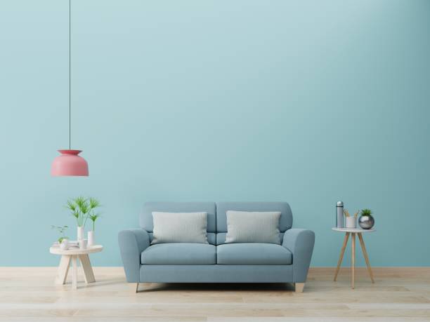 istock Modern living room interior with sofa and green plants,lamp,table on blue wall background. 1205165537