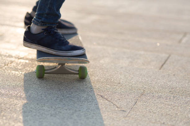 istock Skateboarder skateboarding at sunrise park 1205166681