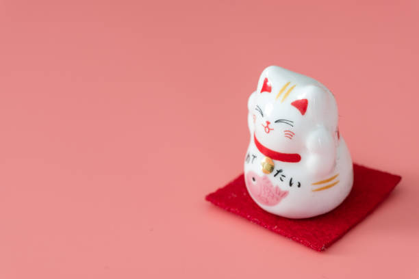 istock ceramics happy cat figure on pure color background view 1205171199