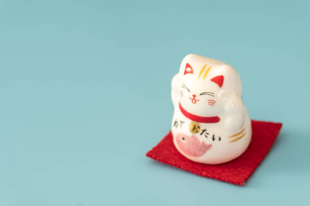 istock ceramics happy cat figure on pure color background view 1205171203