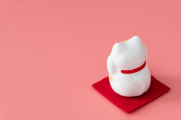 istock ceramics happy cat figure on pure color background view 1205171457