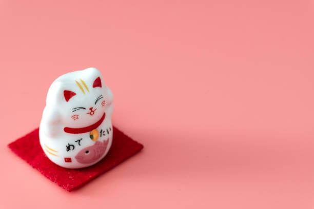 ceramics happy cat figure on pure color background view