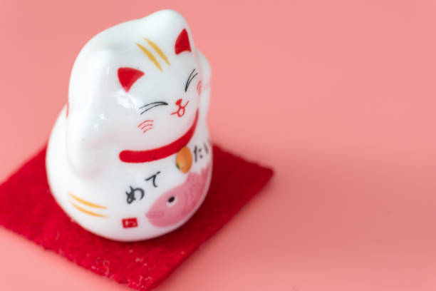 istock ceramics happy cat figure on pure color background view 1205171600