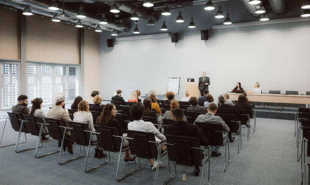 istock Business people sitting at seminar 1205172280