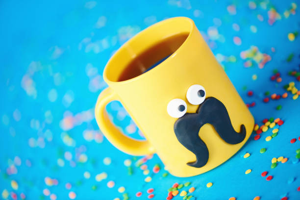 Coffee cup character with eyes and mustache on blue background