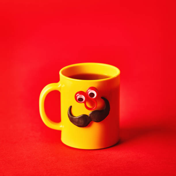 istock Coffee cup character with eyes and mustache on red background 1205174528