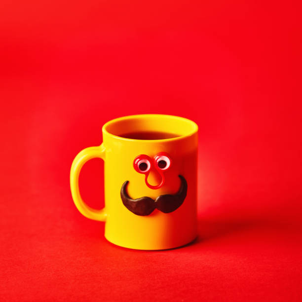 istock Coffee cup character with eyes and mustache on red background 1205174541