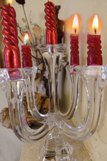 istock Glass candle holder with burning candles 1205175031