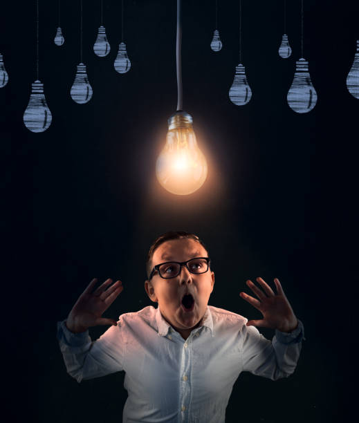 istock Young man having a brilliant idea . Bright light bulb above head. 1205182414