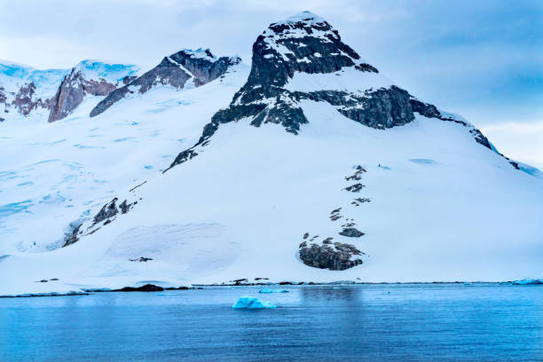 istock Snow Mountains Blue Glaciers Charlotte Bay Antarctica 1205182981