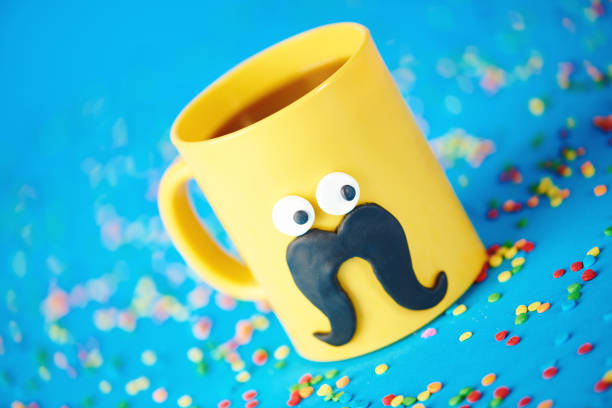 istock Coffee cup character with eyes and mustache on blue background 1205185362