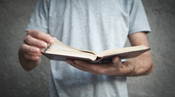 istock Caucasian man reading bible. Religion 1205185996