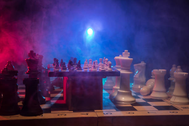 istock Chess figures on a dark background with smoke and fog. Selective focus 1205187619