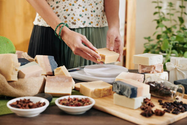 istock Woman cutting handmade soap 1205187846