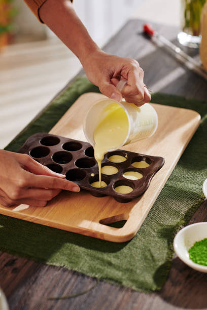 istock Woman making chocolate candies 1205187885