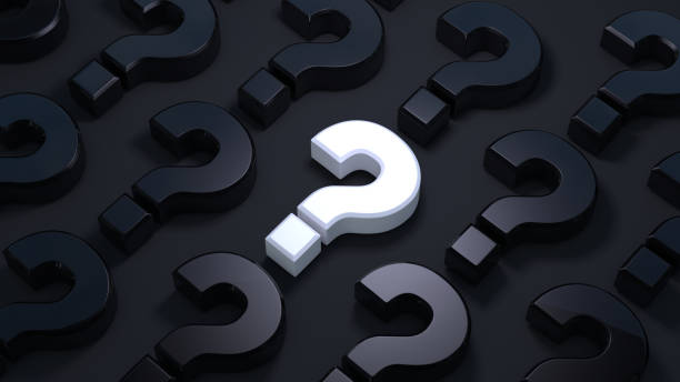 istock A lot of question mark on a dark background. 1205191163