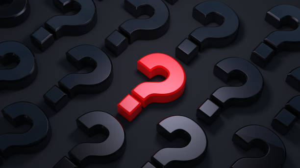 istock A lot of question mark on a dark background. 1205191165