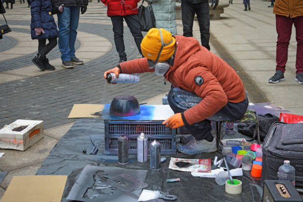 Saint-Petersburg.Russia.February 01.2020.Street artists painting their paintings with spray cans.Artists paint with aerosol paints.Do it quickly and beautifully.
