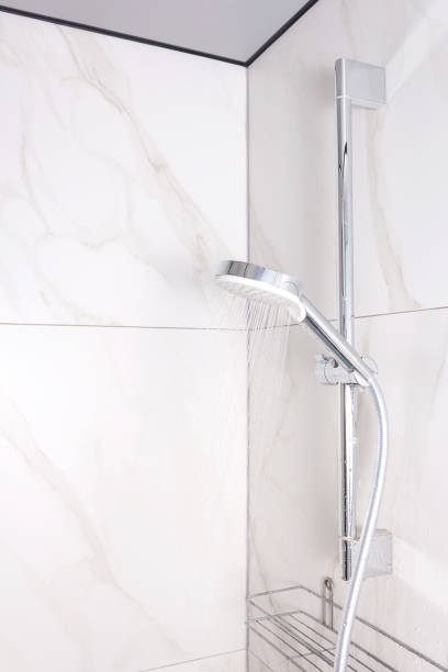 istock Shower with running water in marble bathroom. 1205192659